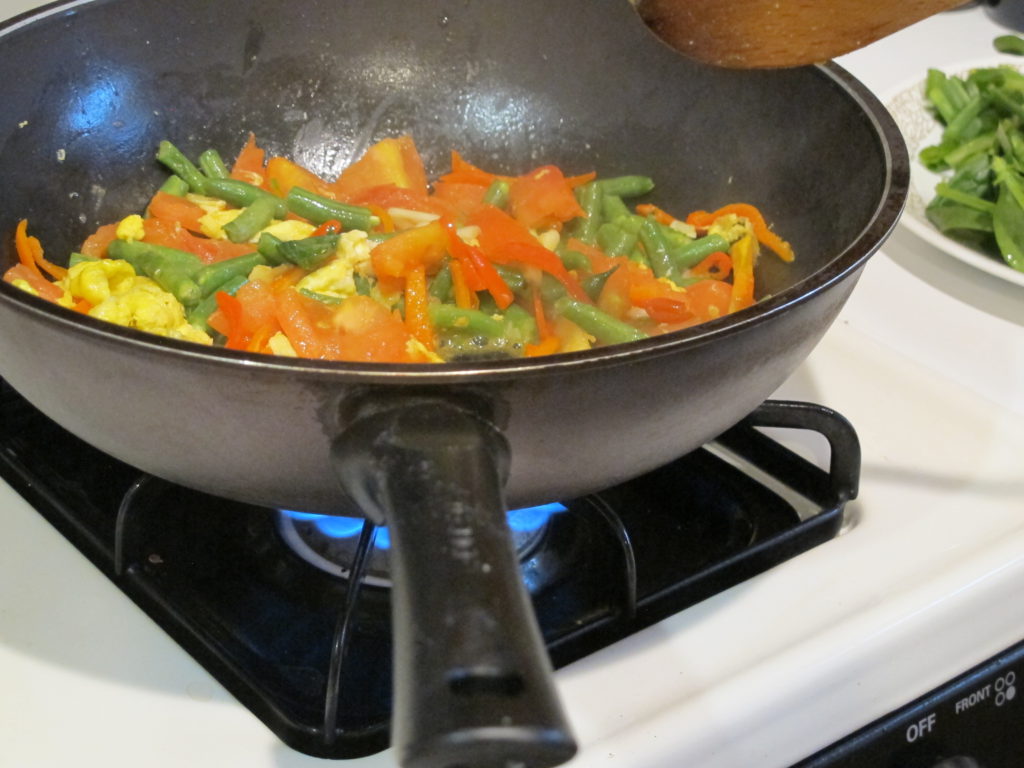 Frying Eggs with Tomatoes